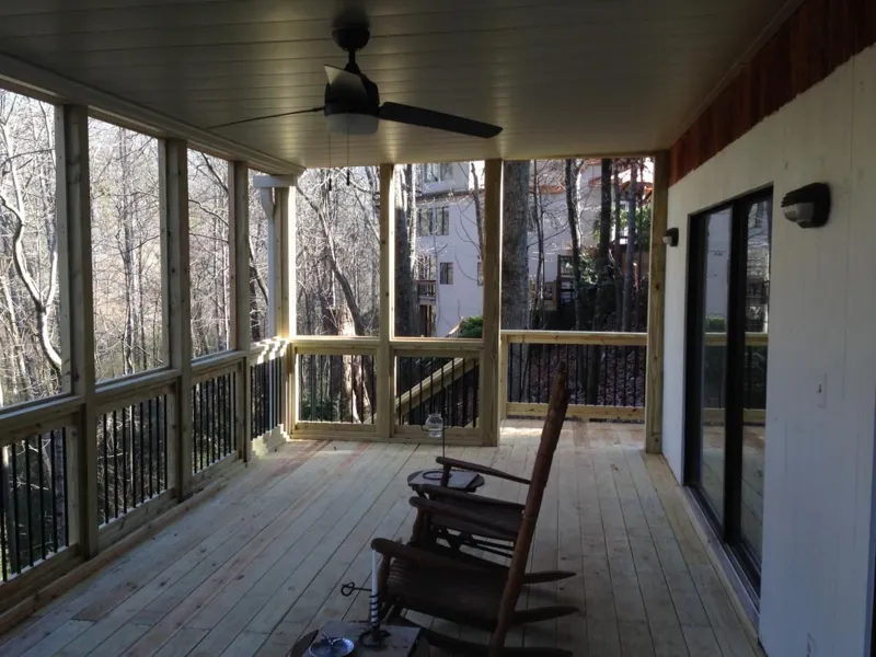 Elevated deck overlooking a wooded backyard, built by 4 Seasons